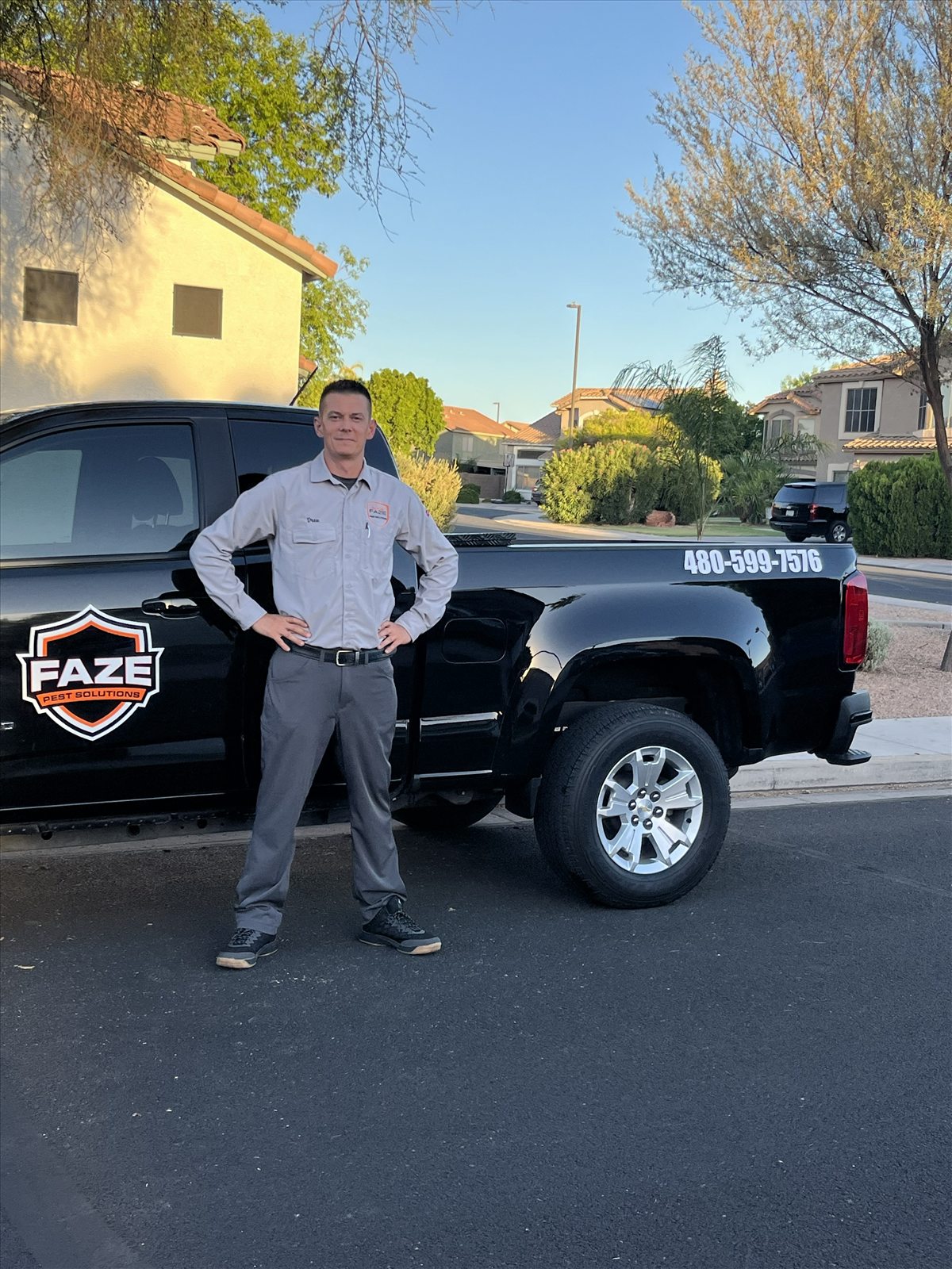 Drew with Faze Pest Solutions truck showing logo and phone number
